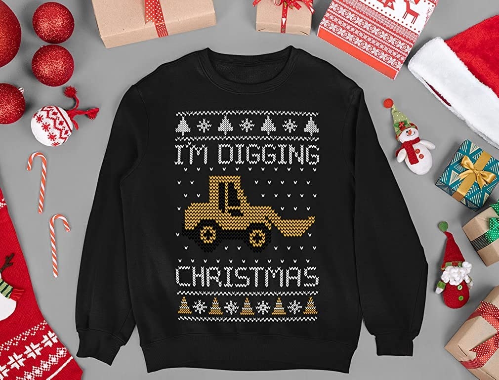 a black sweatshirt with a truck on it that says &quot;i&#x27;m digging christmas&quot;