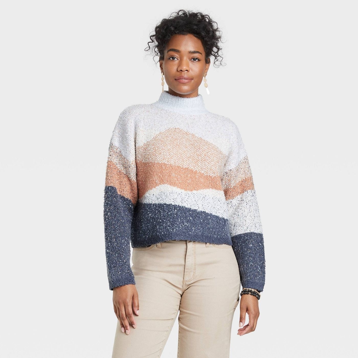 A multi color mock turtle neck sweater