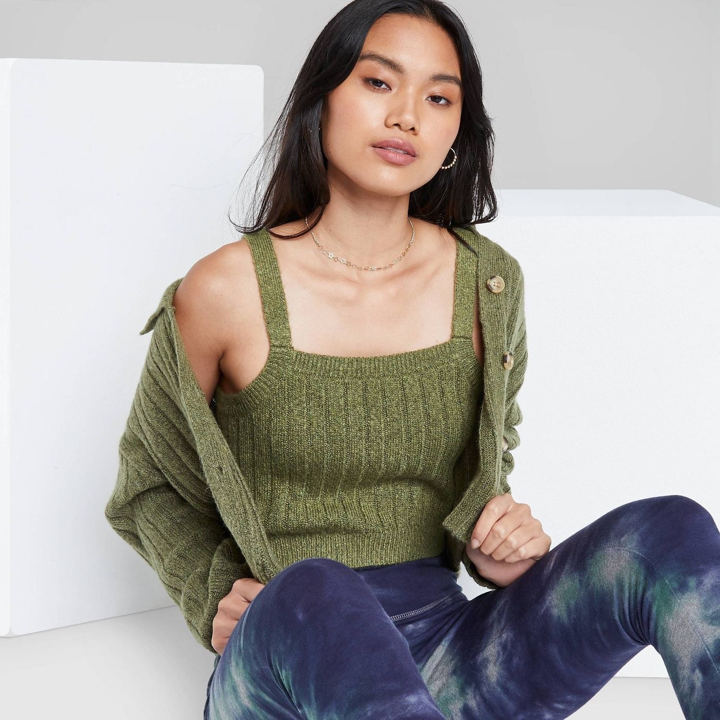 A green ribbed sweater tank