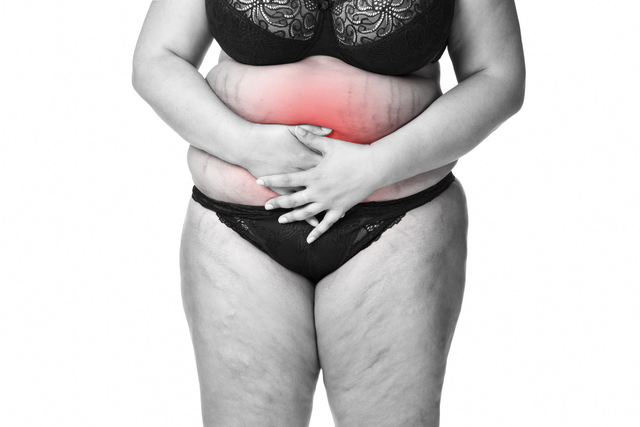 Woman holding her stomach in pain