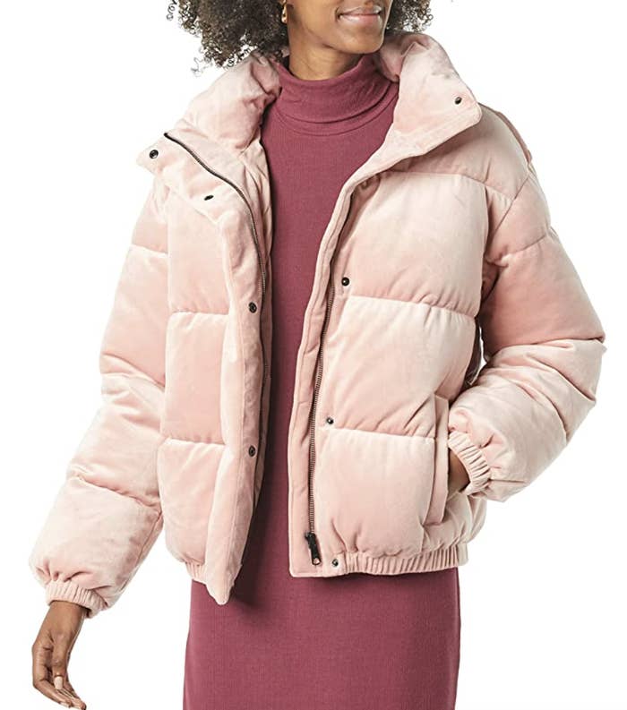 model wearing velvet puffer coat in pink