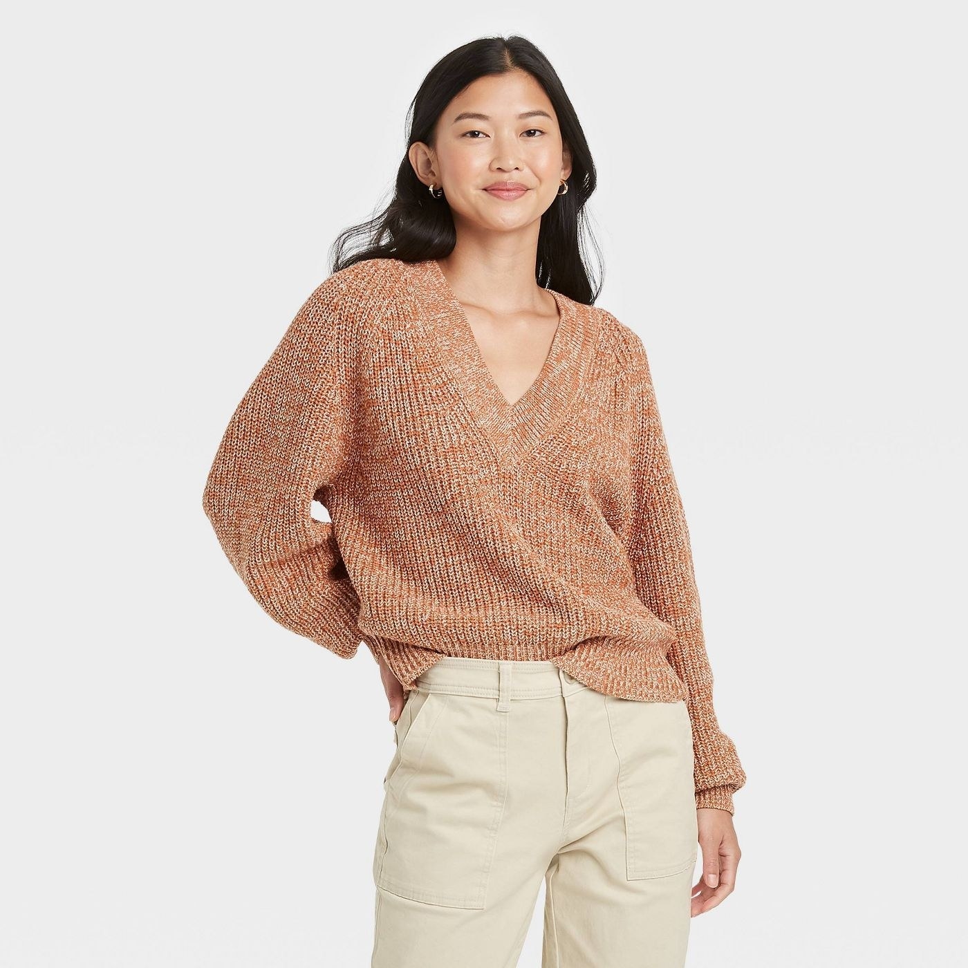 A rust pullover sweater