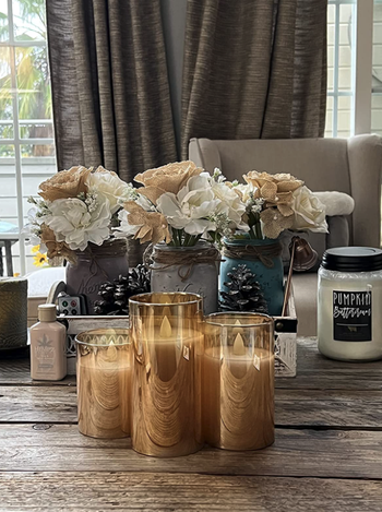 reviewer image of the glass candles styled on table without being lit