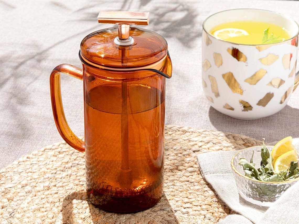 French Press in an amber colored glass