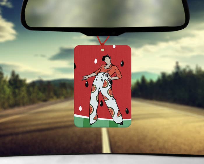 square-shaped car air freshener with illustration of Harry Styles in watermelon pants