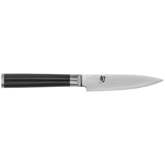 A Shun paring knife on a white background.
