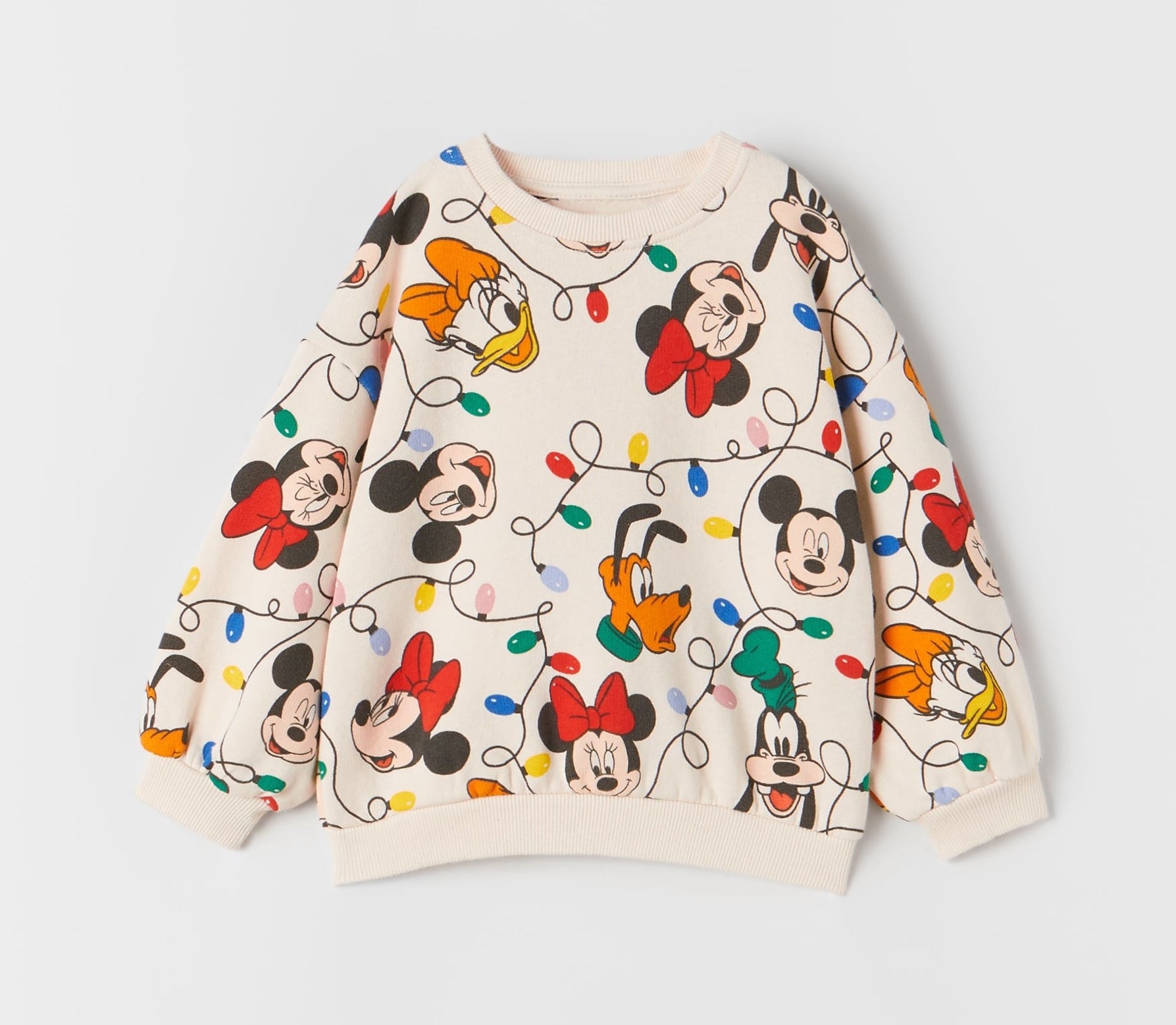 an off white sweater with mickey, minnie, donald, goofy, daisy, pluto, and christmas lights on it