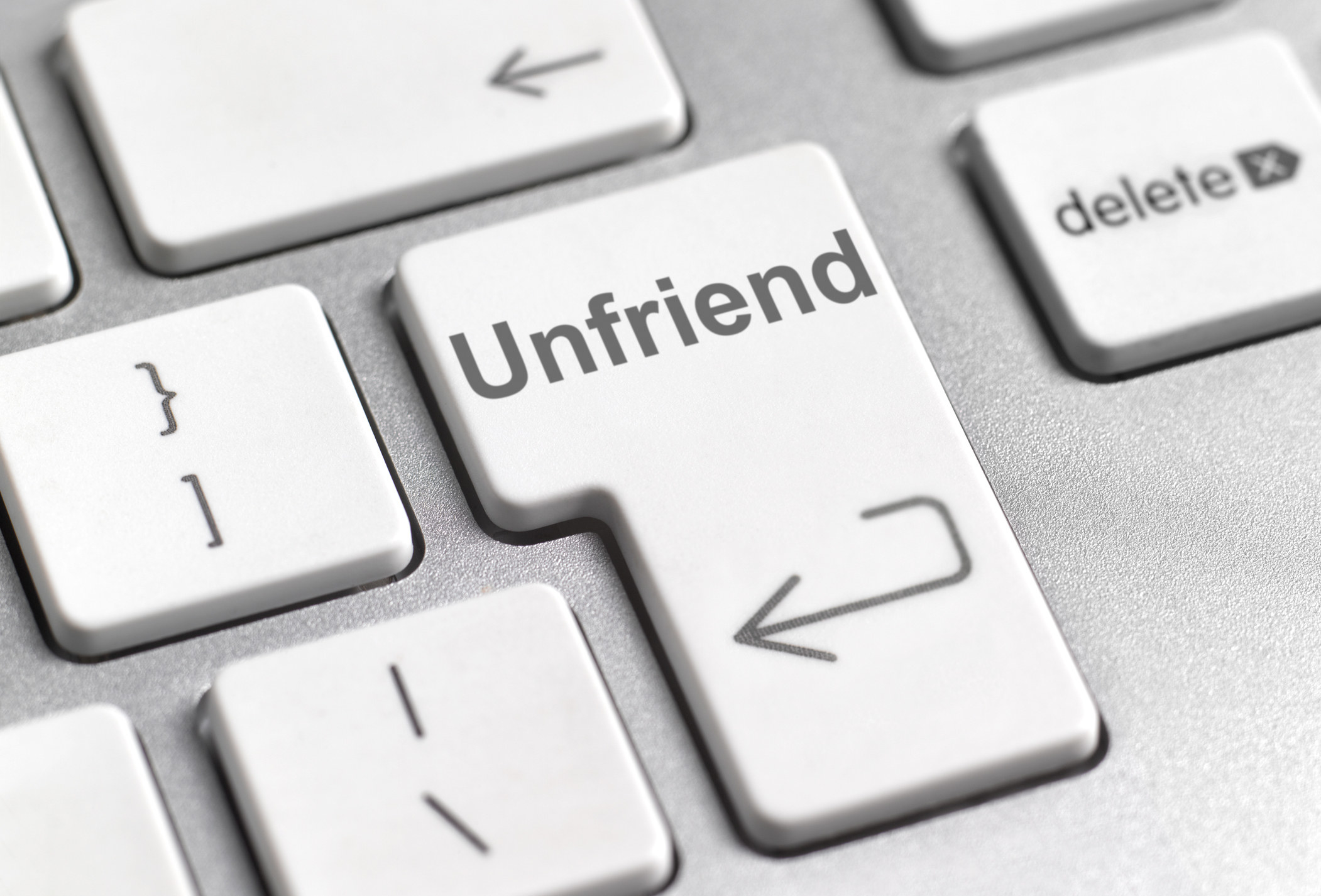 Computer keyboard with a return key that reads &quot;unfriend.&quot;
