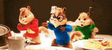 the chipmunks dancing on a dinner table
