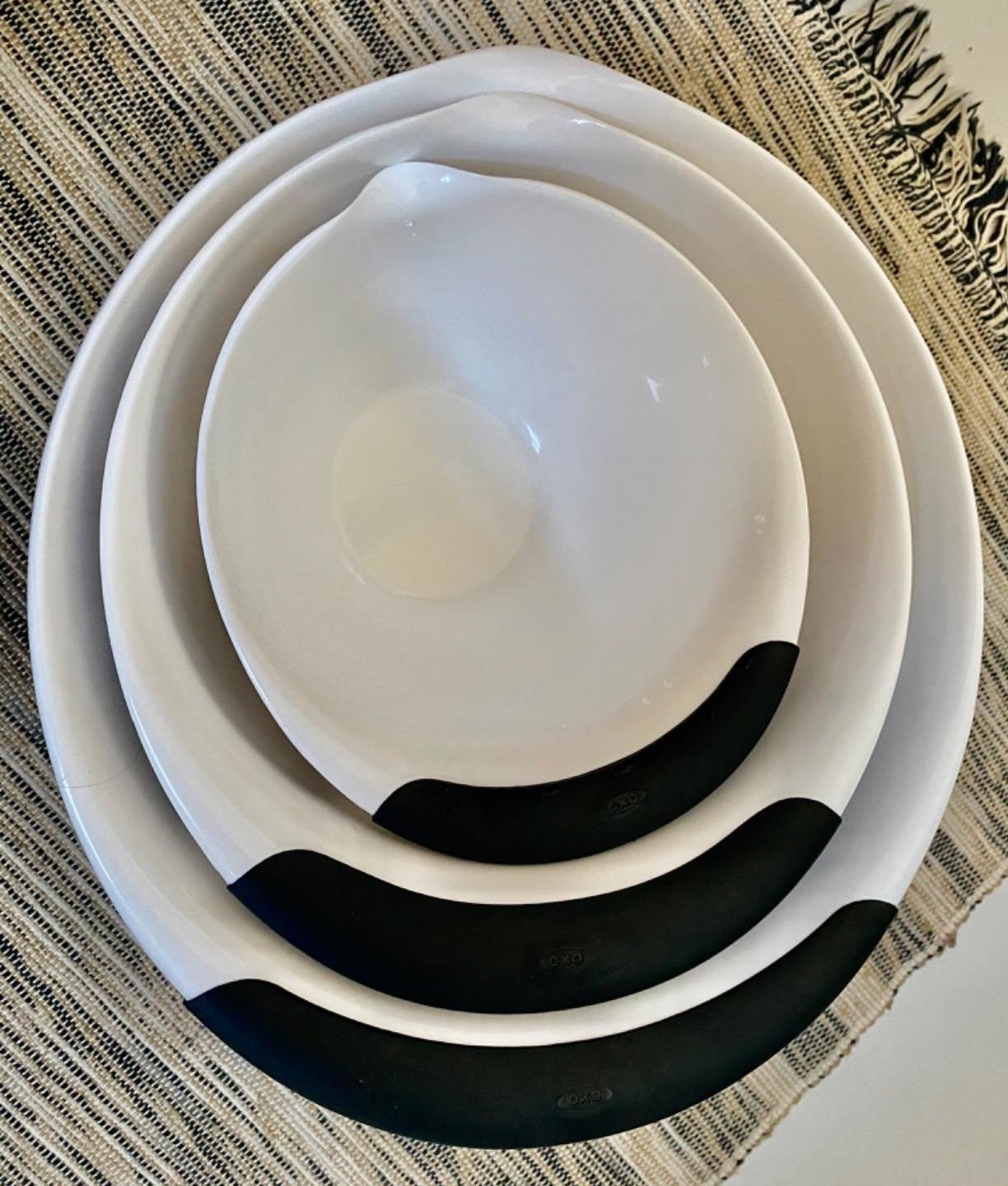 Reviewer photo of the white mixing bowls stacked inside one another