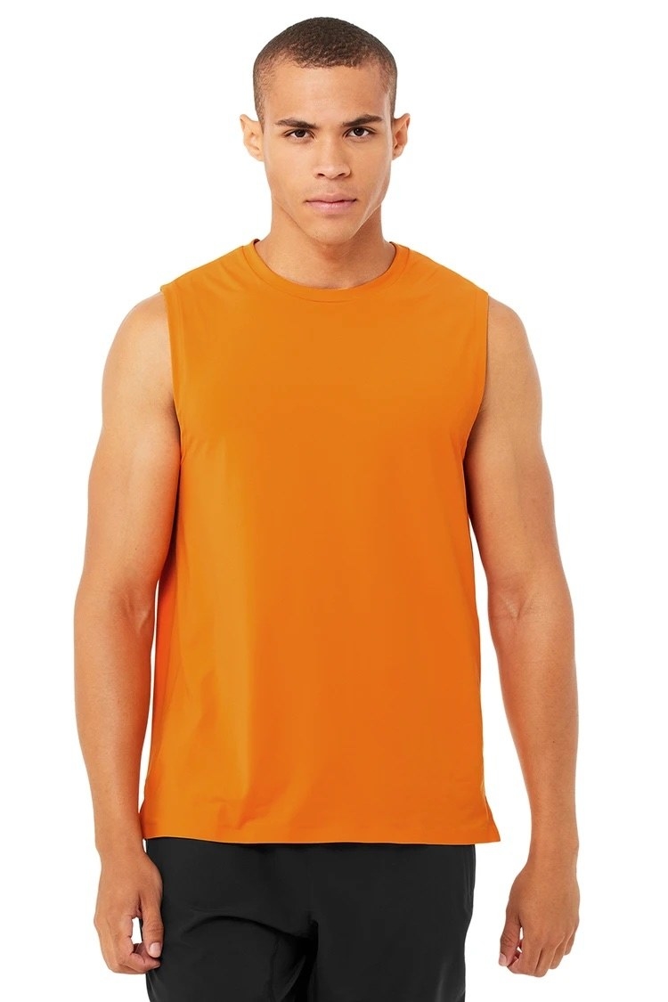 Model wearing the tank in orange