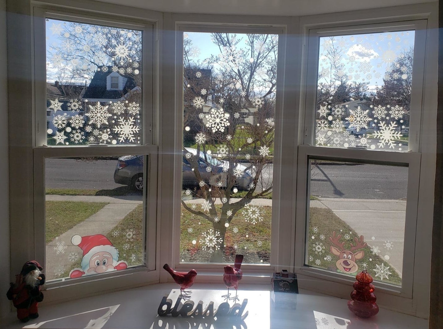A reviewer&#x27;s window with snowflake clings on them