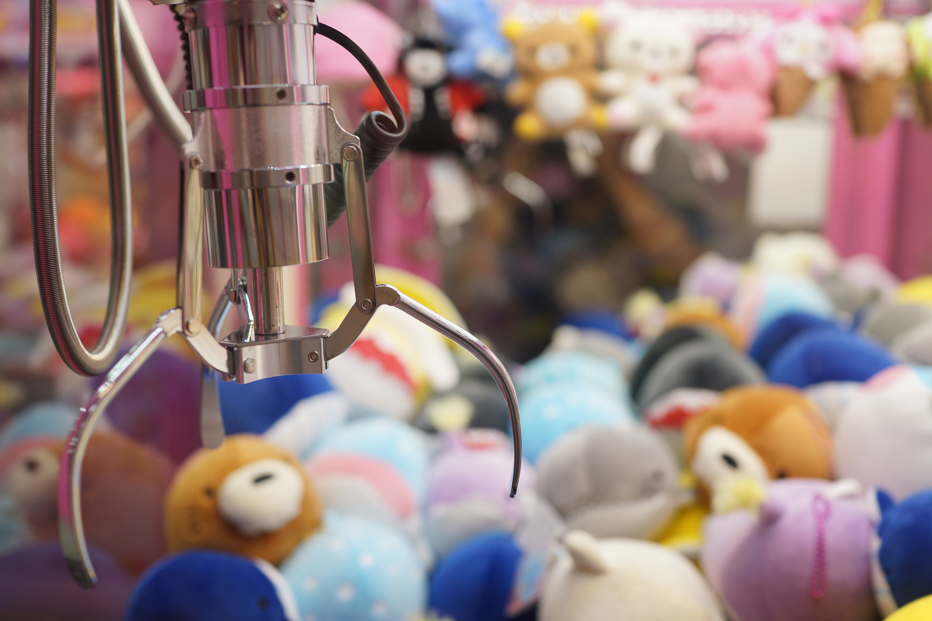 A crane machine filled with plush toys
