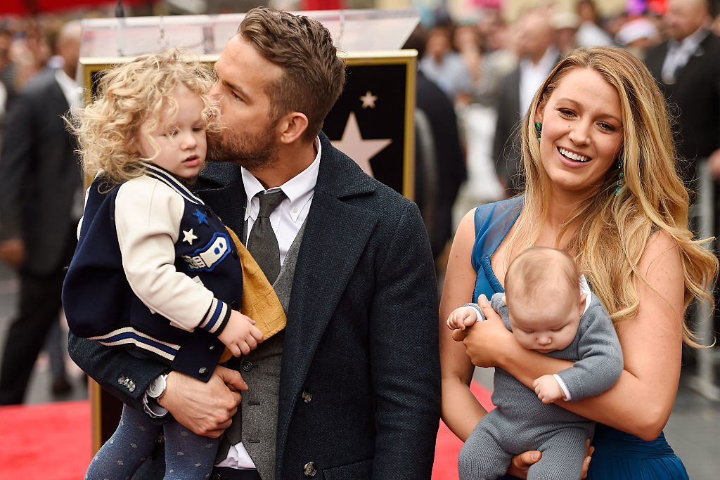 Ryan Reynolds (L) and Blake Lively pose with their daughters as Ryan Reynolds is honored with star on the Hollywood Walk of Fame