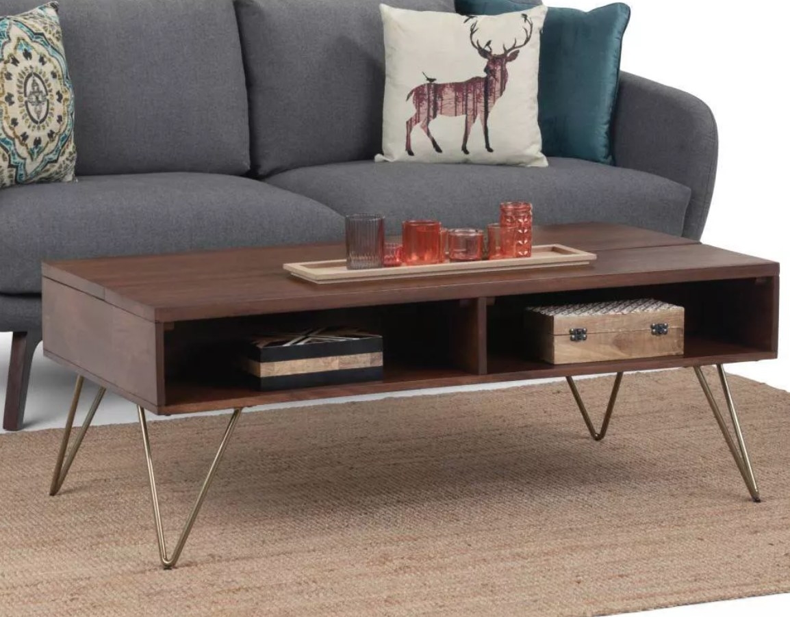 Wooden coffee table with top that rises