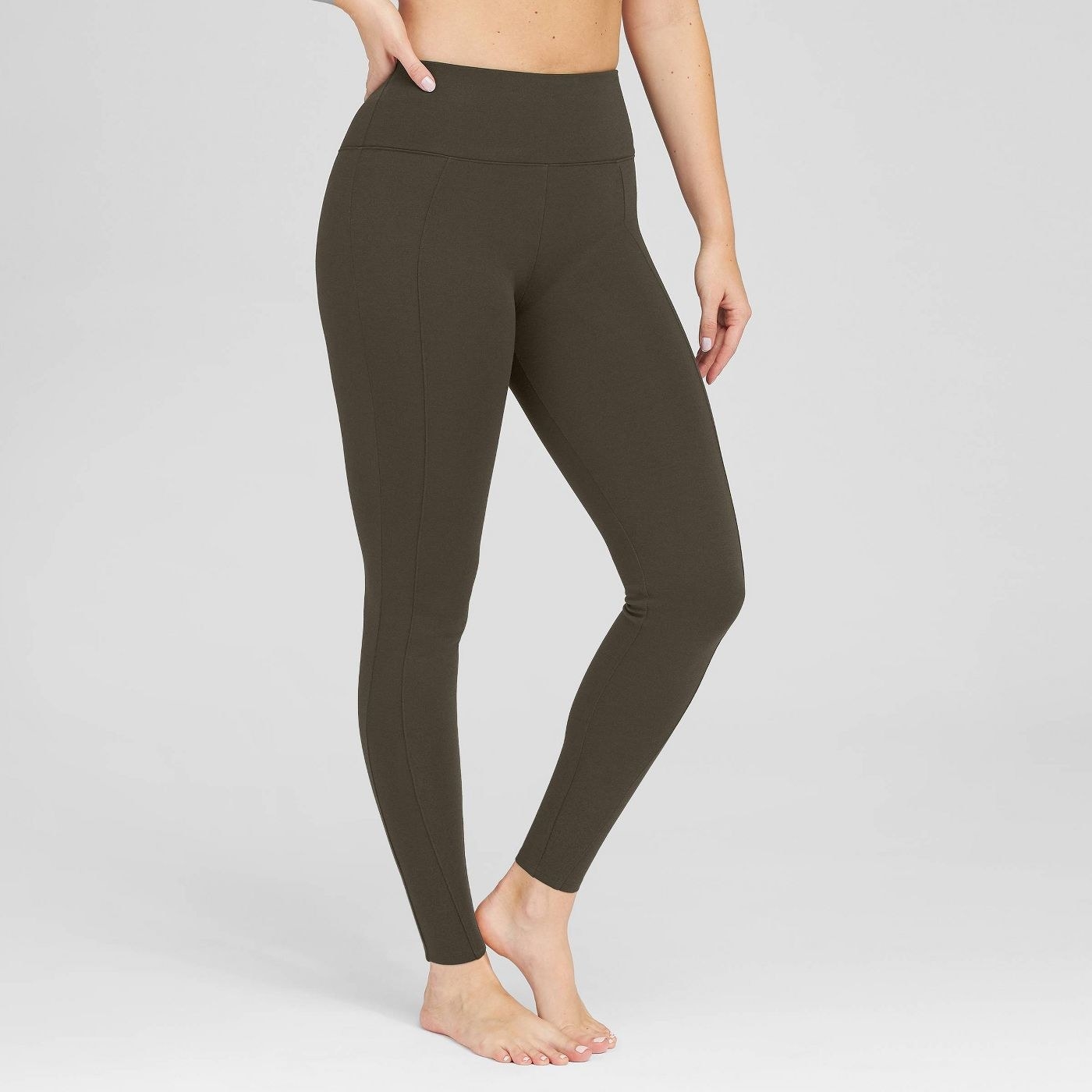 A pair of olive green leggings