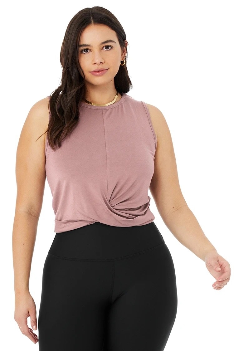 Model wearing the pink ruched crop top