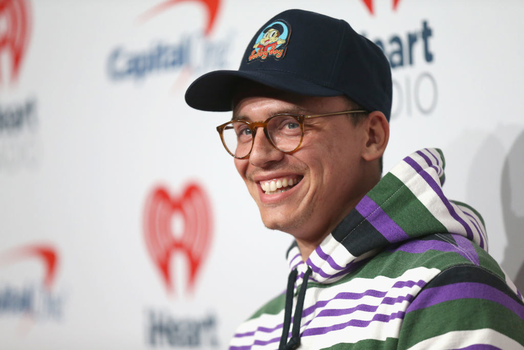 Logic smiles on the red carpet at an event