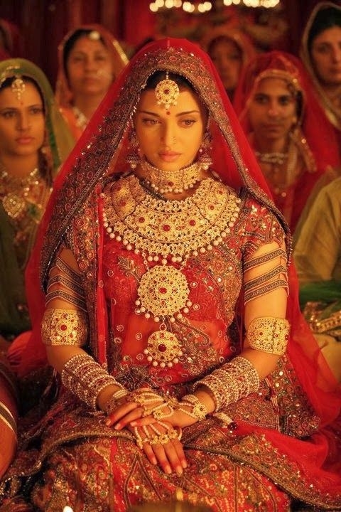 Aishwarya Rai Bachchan dressed in a heavy, traditional red lehenga, for her character as Jodhaa Bai in the Bollywood movie Jodhaa Akbar.