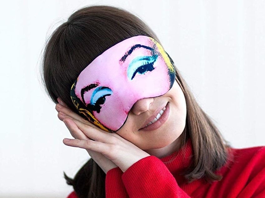 A model wearing the eye mask designed to look like Marilyn Monroe&#x27;s eyes and eyebrows