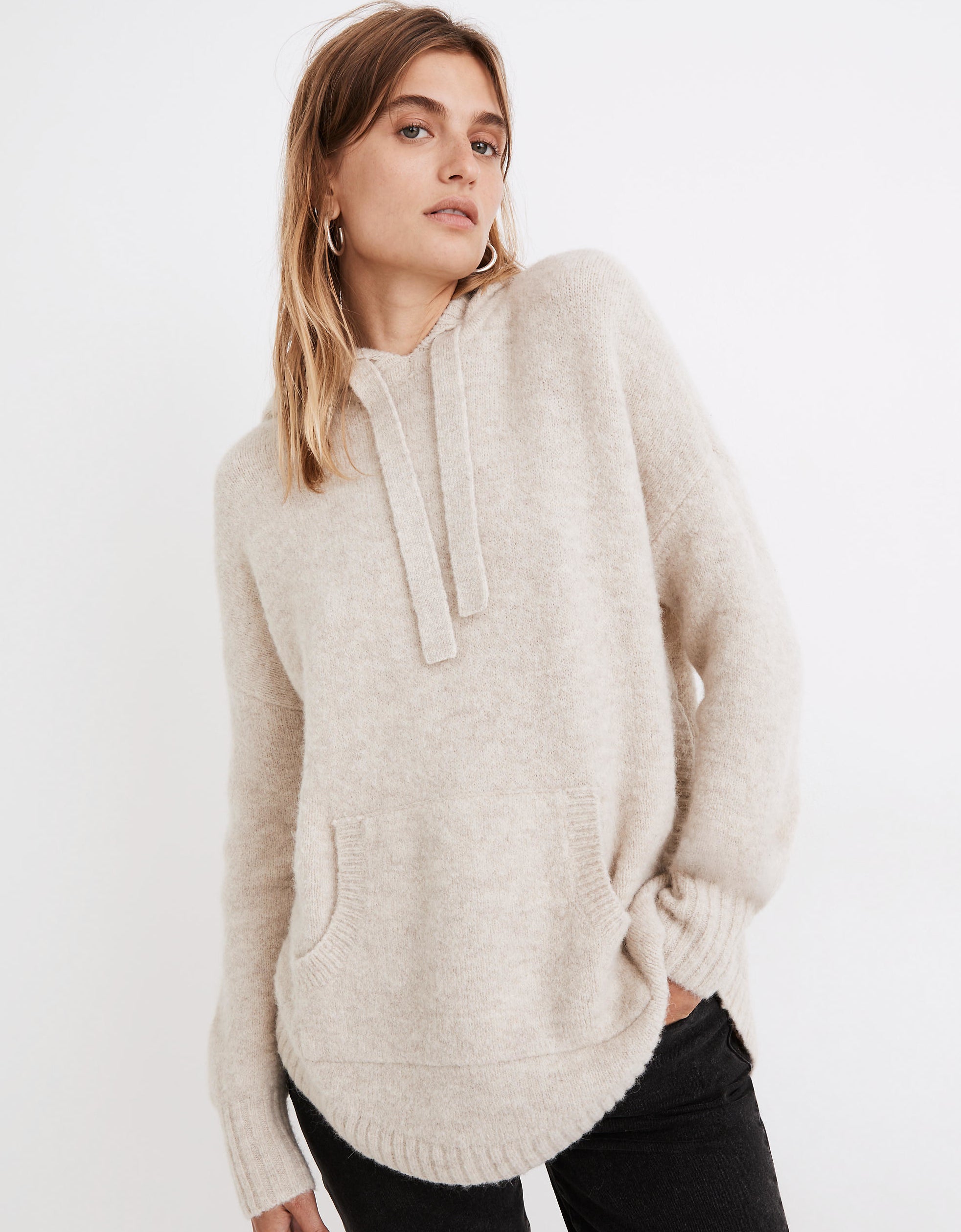 model wearing the cream hoodie sweater