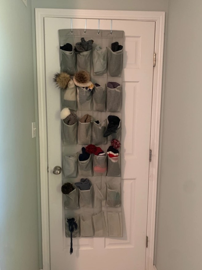 A grey over the door shoe organizer in a reviewers home