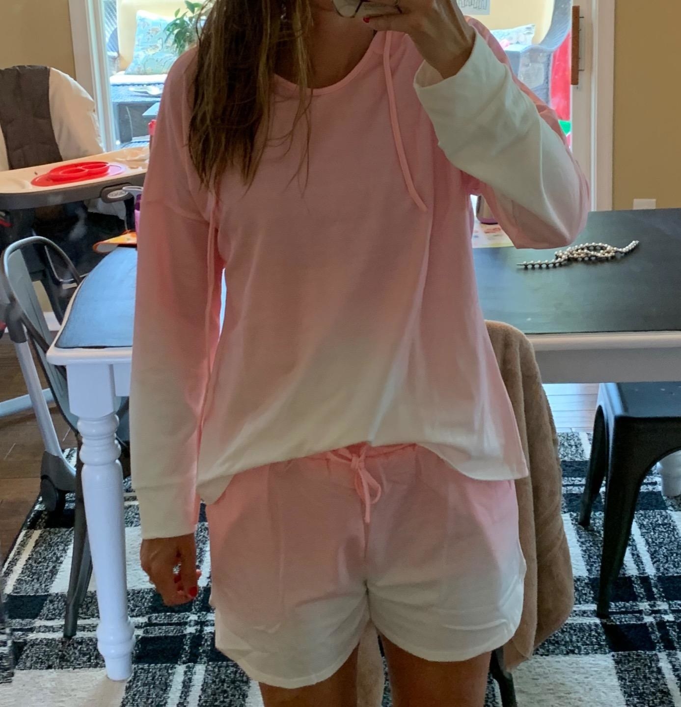 Reviewer is wearing a pink and white gradient short and long sleeve loungewear set