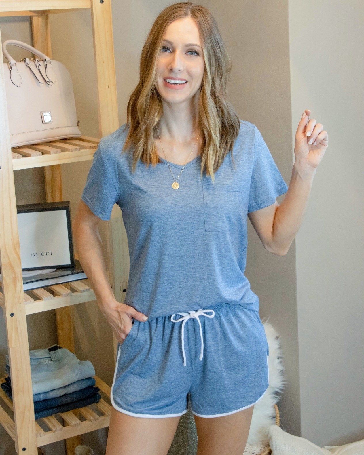 Reviewer is wearing a light blue short sleeve loungewear set with shorts