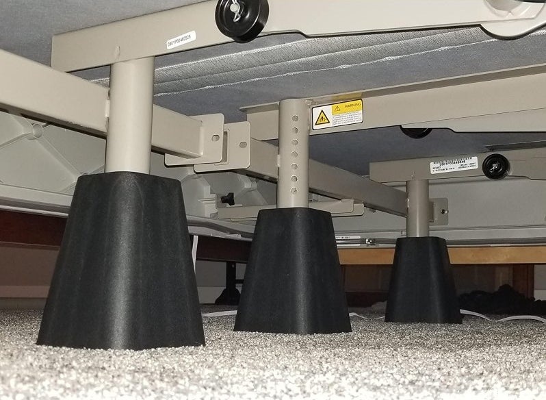 A set of three bed risers under a reviewer&#x27;s bed