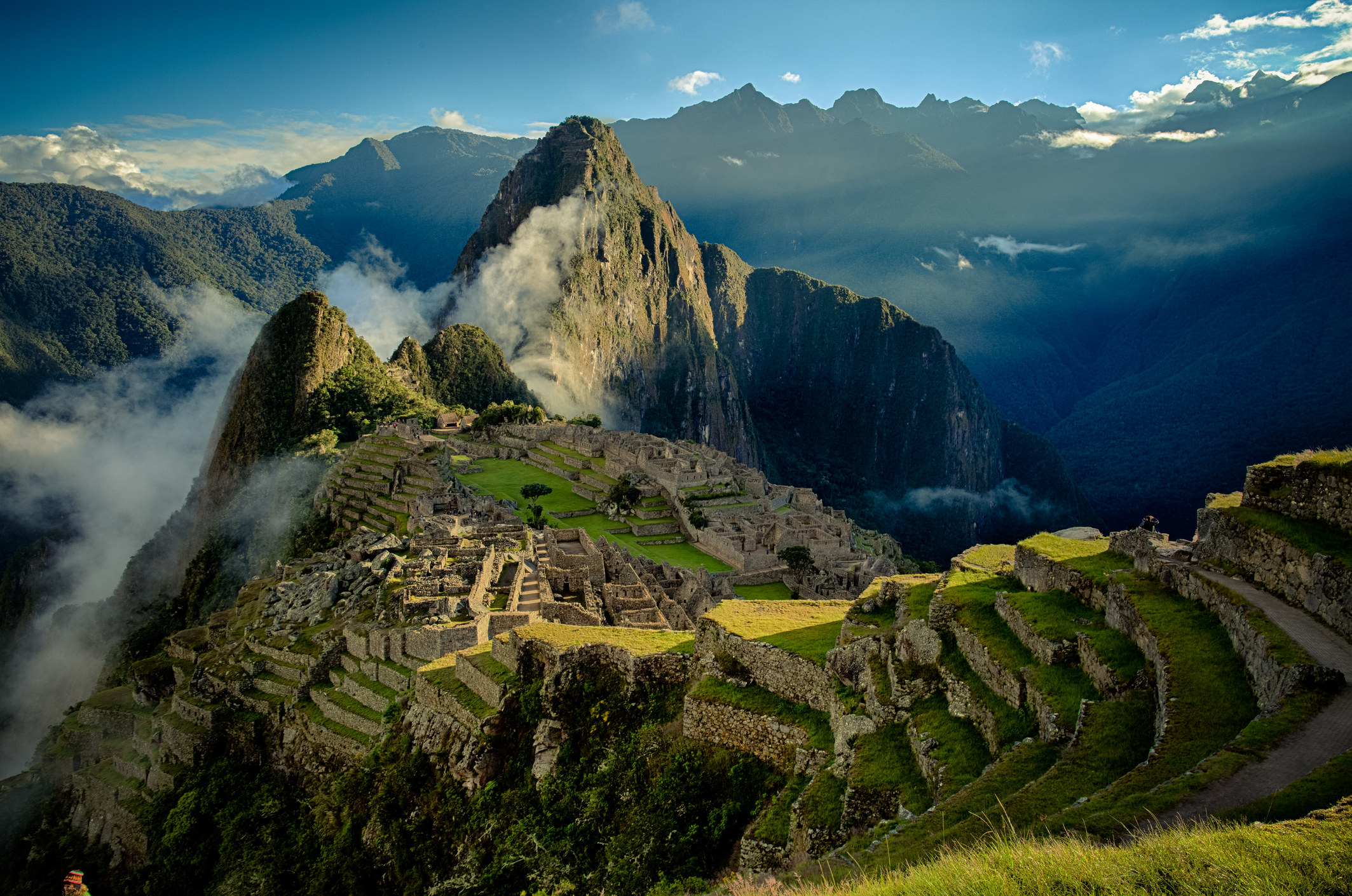 Machu Picchu surrounded by clouds.