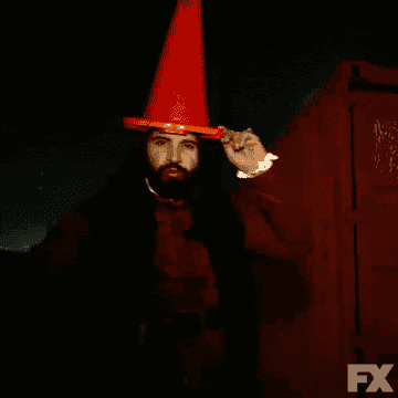 Nandor, high on drug blood, wearing a traffic cone as a hat in &quot;What We Do in the Shadows&quot;
