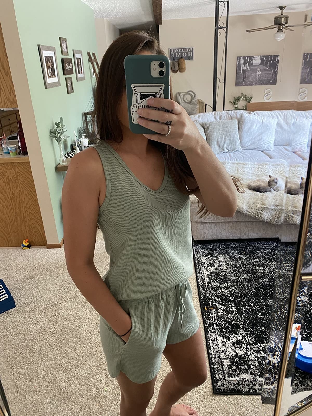 Reviewer is wearing a pale green tank top and short pajamas set
