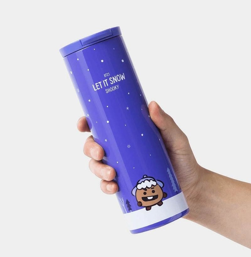 someone holding a tall and slim tumbler with the character shooky on it