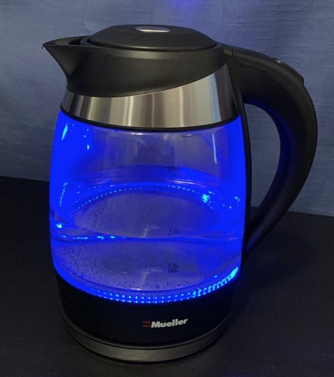 A reviewer&#x27;s blue and black electric kettle