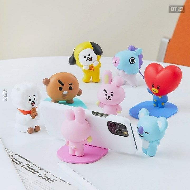 a collection of phone stands each shaped like different bt21 characters