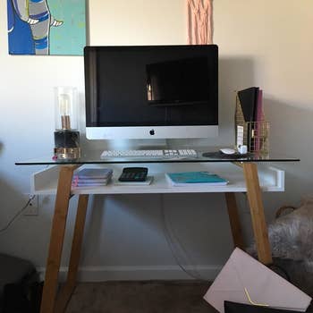 Reviewer photo of their office setup with the glass top desk