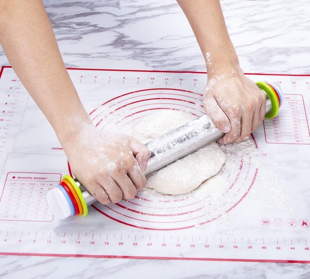 Model using the adjustable rolling pin to roll out dough on top of a baking mat