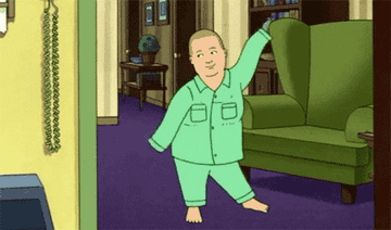 A gif of Bobby from King of the Hill dancing around in his green pajamas
