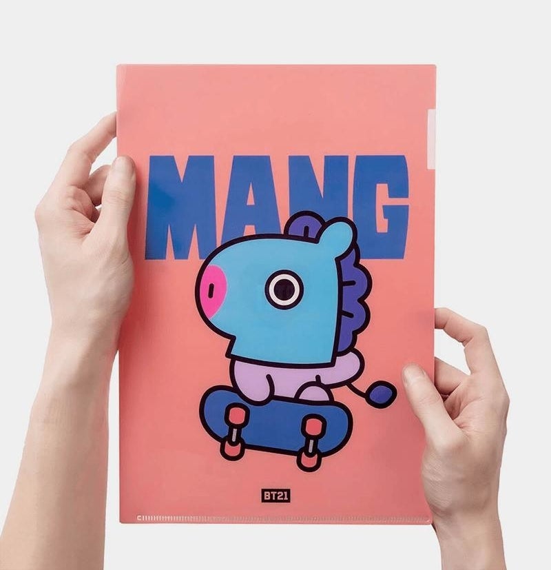 a person holding up a folder with the character mang on the front