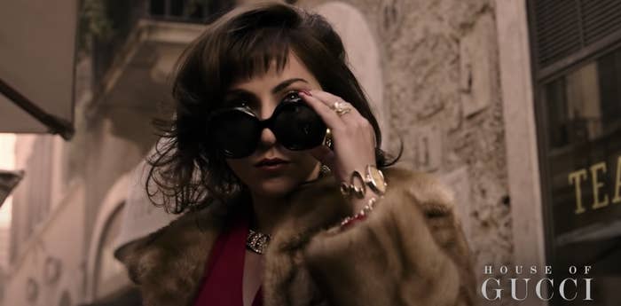 Patrizia lowering her sunglasses in &quot;House of Gucci&quot;