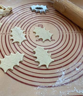 Reviewer photo of leaf-shaped dough being cut out on the baking mat