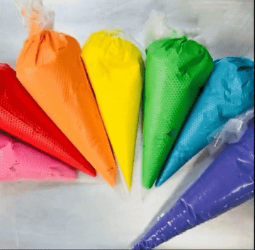 Reviewer GIF showing the piping bags filled with rainbow-colored frostings