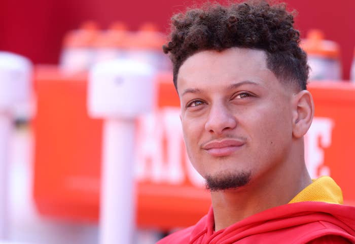 Patrick Mahomes smiles on the bench