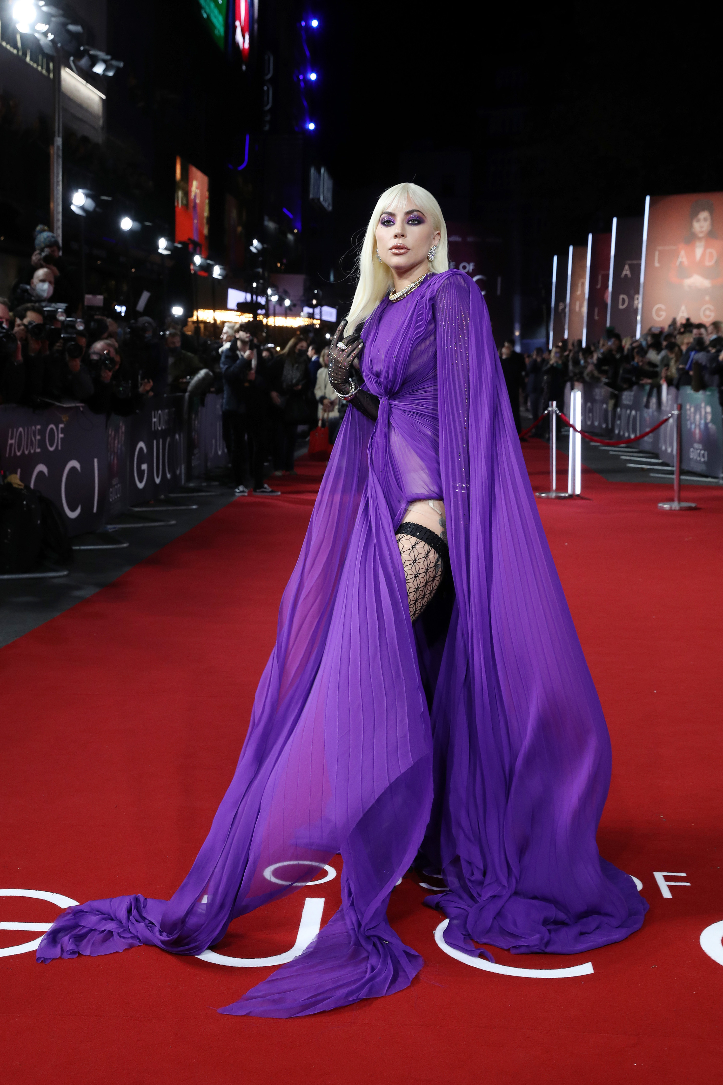 Gaga showing off the slit in her gown on the red carpet