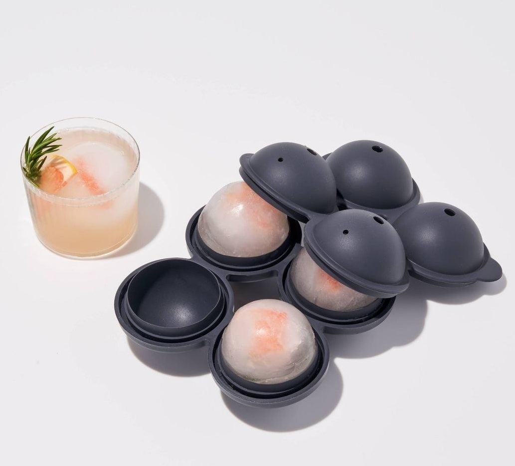 grey silicone spherical ice tray with a lid that can make four ice balls