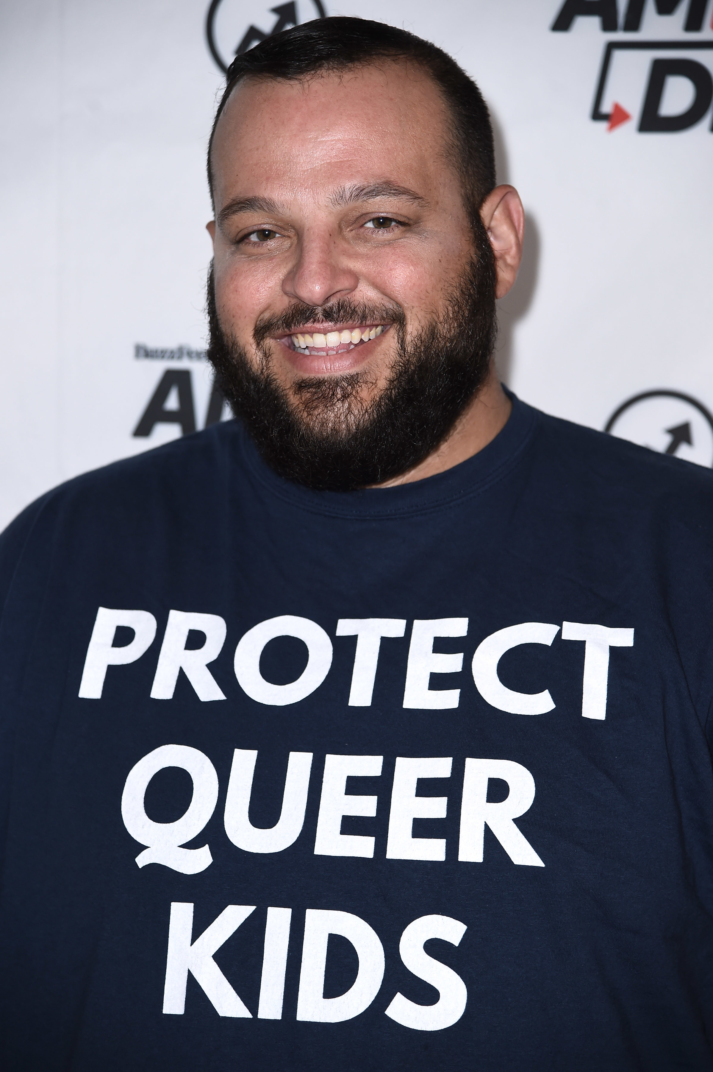 wearing a protect queer kids shirt