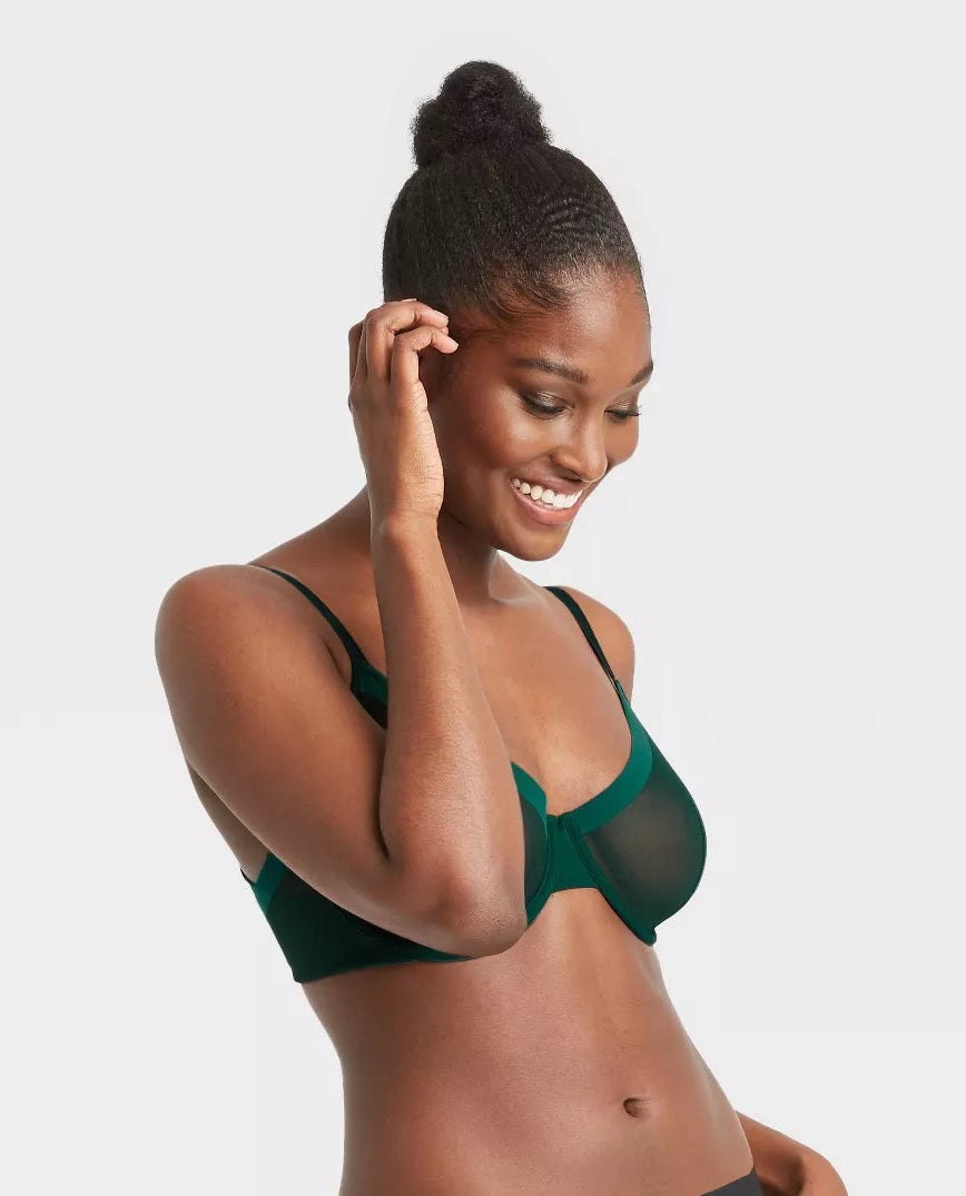 Model wearing green mesh unlined bra
