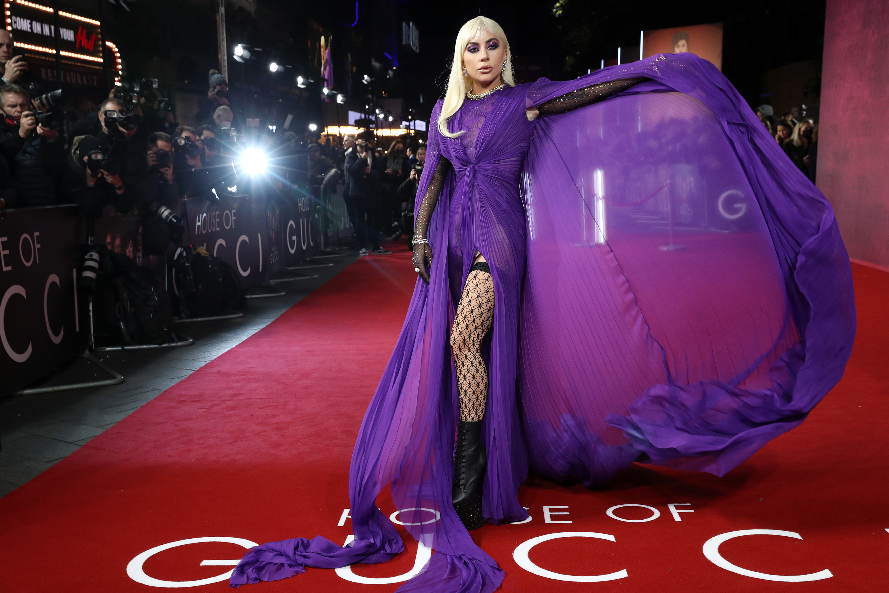 Gaga holding up one side of her gown like it&#x27;s a cape