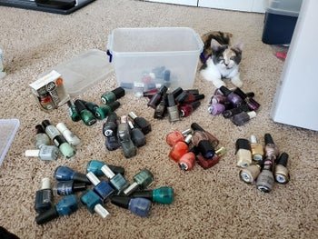 reviewer image of heaps of disorganized bottles of nail polish