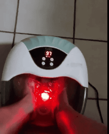 a gif of a reviewer using the foot spa's bubble and heat features